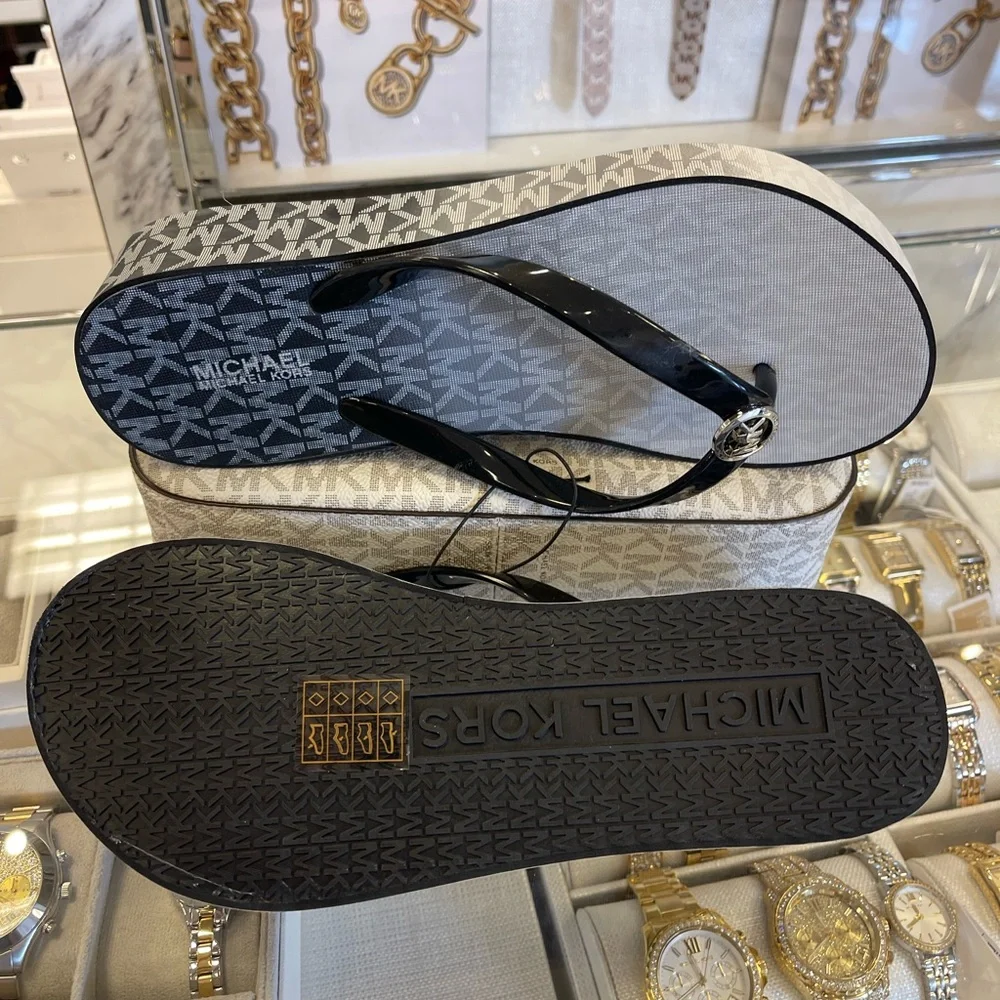 Michael Kors BEDFORD FLIP FLOP
PVC/OMBRE MK SIG
49R6BDFA1Q
Black 
NWT
Platforms - Picture 3 of 16